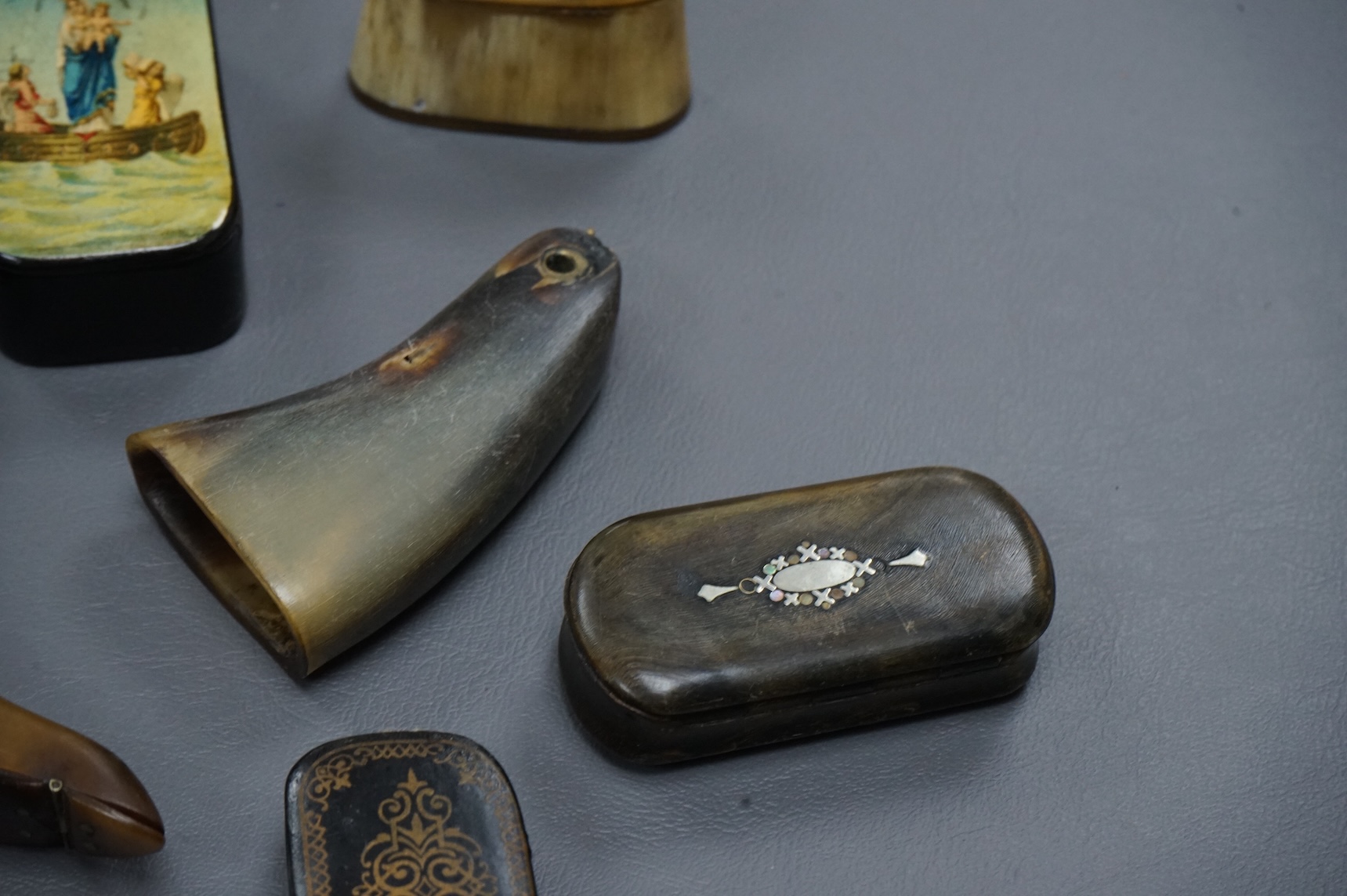 Eleven assorted horn, lacquered and ebony snuff boxes, the majority 19th century, largest 8.5cm long.